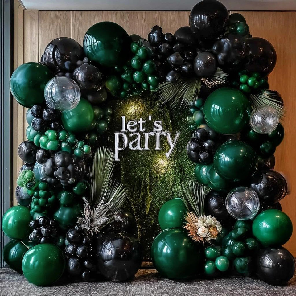 DOUBLE STUFFED black green balloon arch kit with dark emerald tones for moody event visuals
