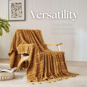 Down Home queen size blanket draped on bed creating a layered look