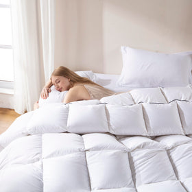 DOWNCOOL comforter on California King bed with corner tabs for secure duvet attachment