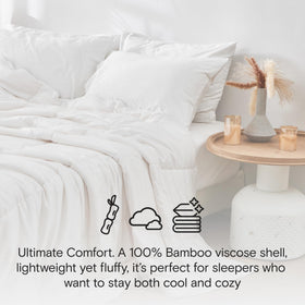 DOZ all-season comforter on bed highlights lightweight, breathable warmth for comfortable nights.