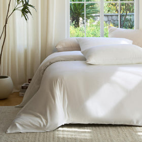 DOZ by SIJO Snow pillowcases on bed demonstrate coordinated luxury and soft drape