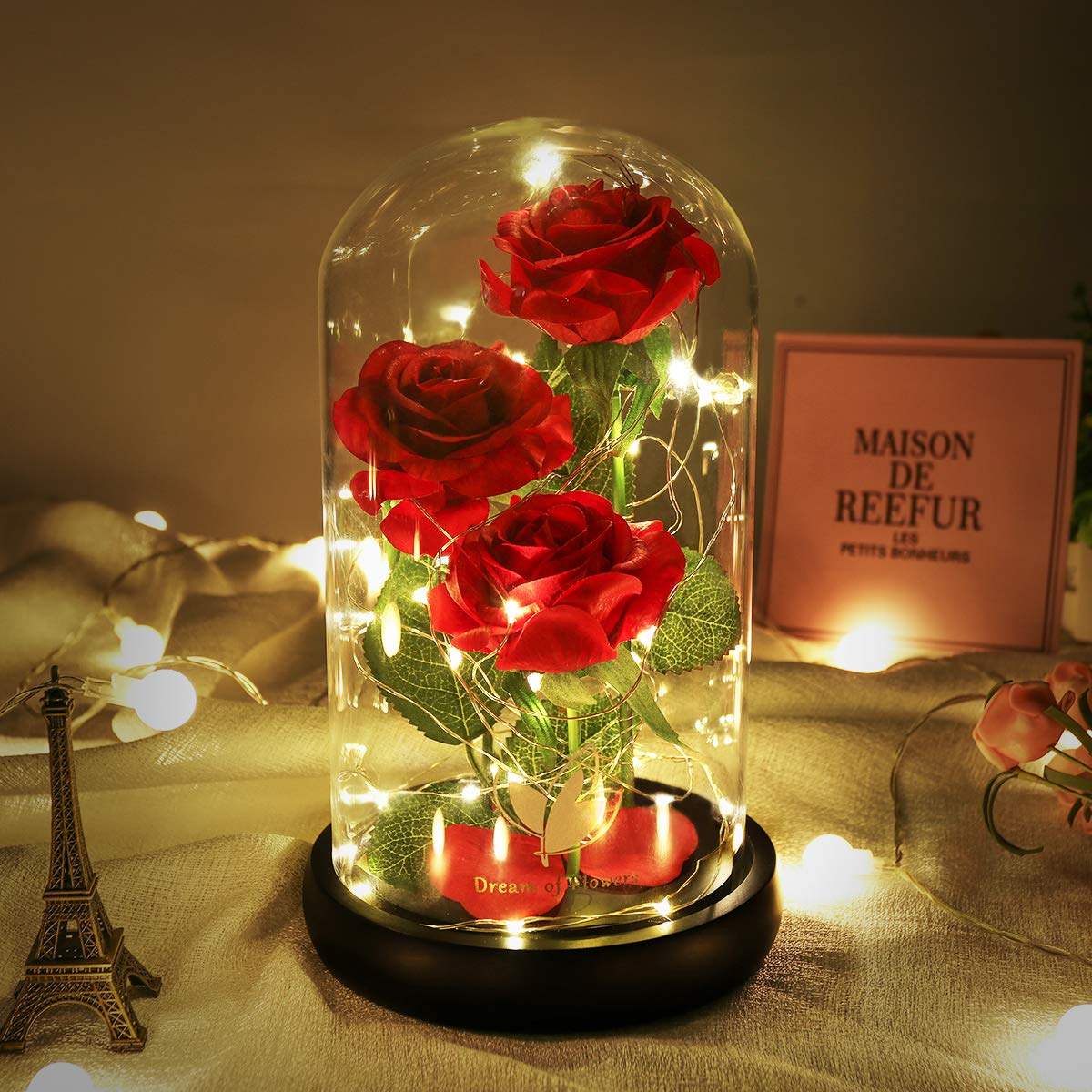 Dream of Flowers Beauty and the Beast Rose glows inside a glass dome for romance.