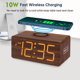 DreamSky wireless charging dock powers a phone at the clock.