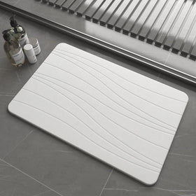 Drvykkn fast-drying stone bath mat closeup highlights ultra-absorbent texture that dries feet quickly.