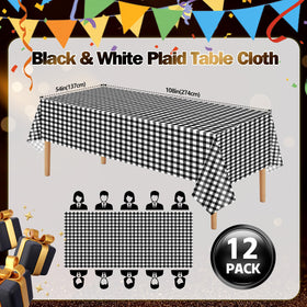 Dualshine 54x108 inch waterproof tablecloth shields a wooden table.