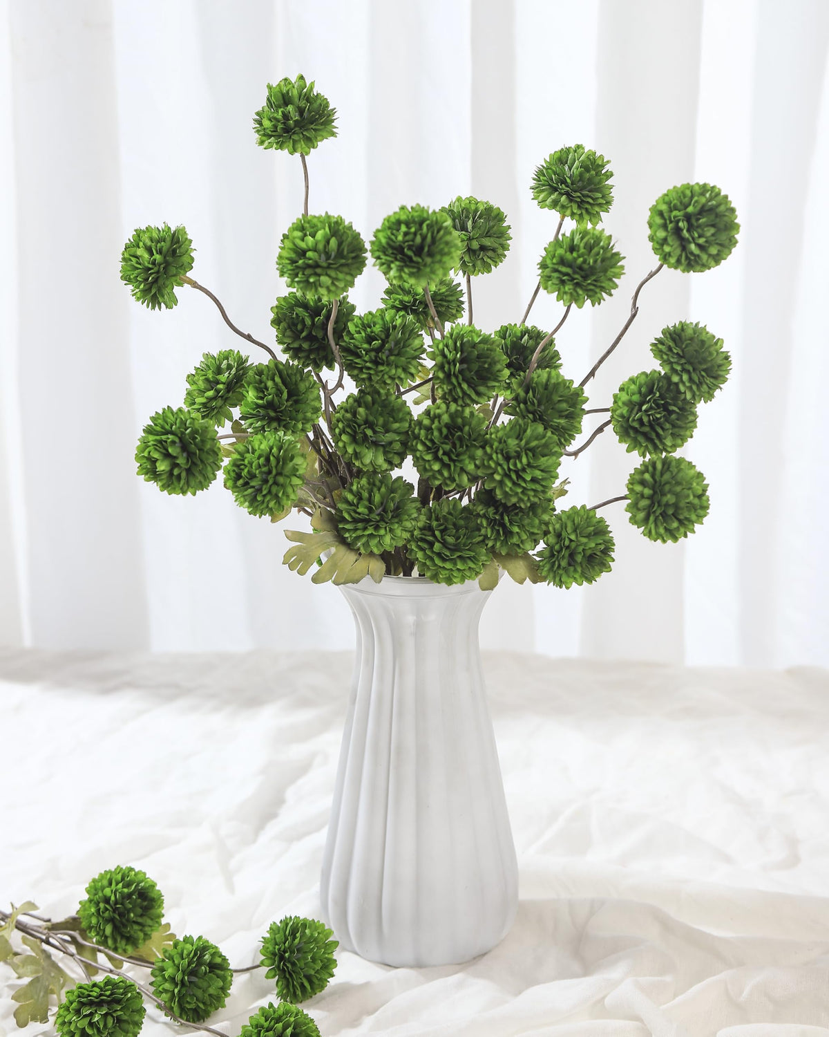 Chic pom-pom mums add modern or rustic charm to dining tables.