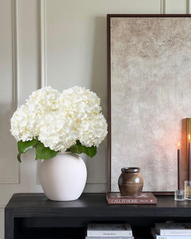 DuHouse white hydrangea centerpiece evokes fresh elegance for living rooms.