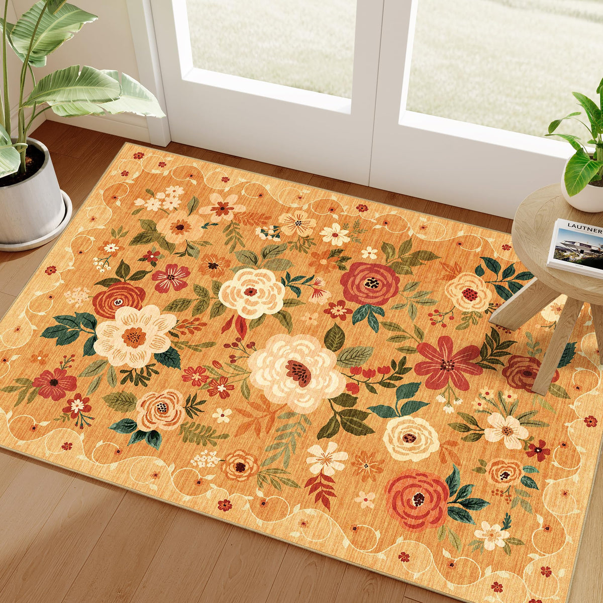 DUKINO floral entryway rug orange adds color and safety with a non-slip backing.