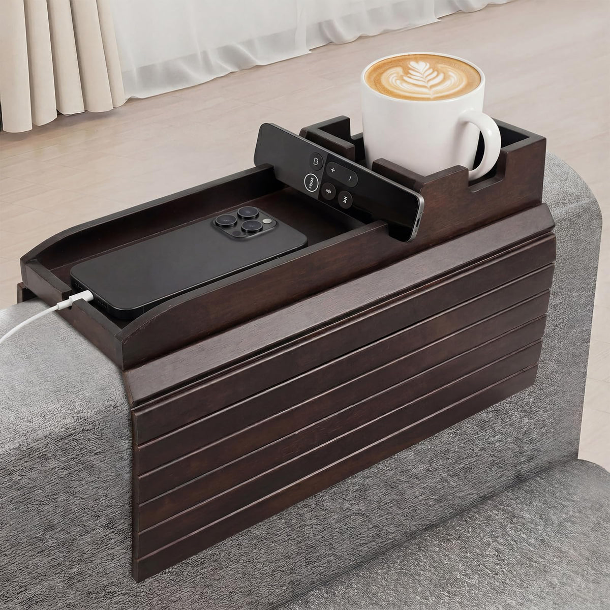 Dumbpec bamboo couch arm tray with built-in cup holder for stable drinks.