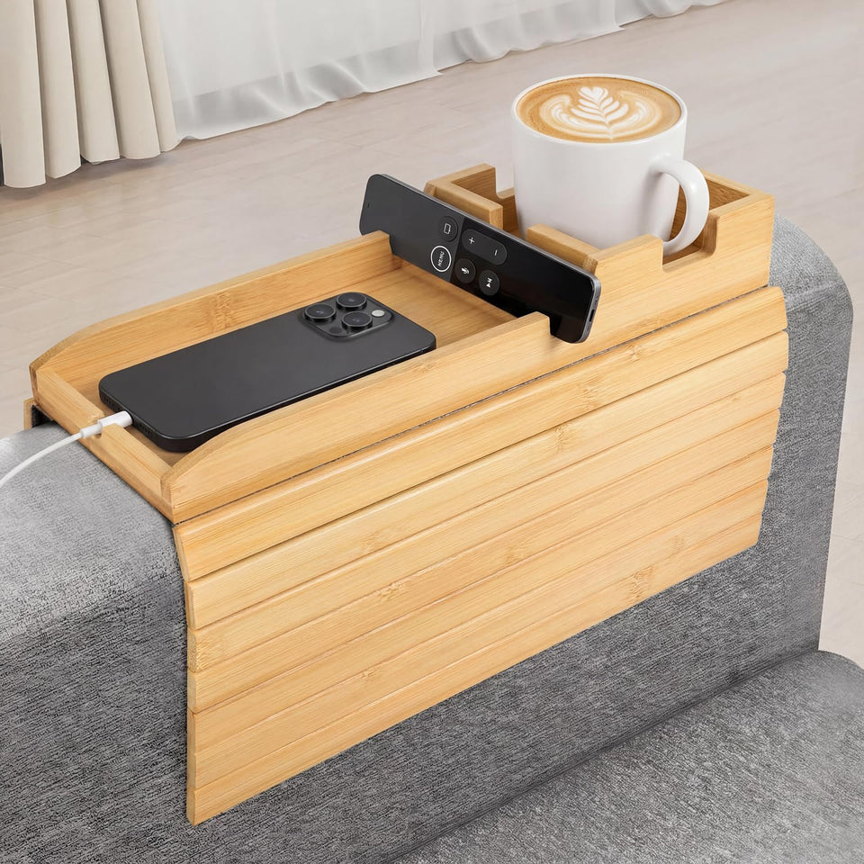 Dumbpec bamboo arm tray on sofa arm holding a drink for easy reach