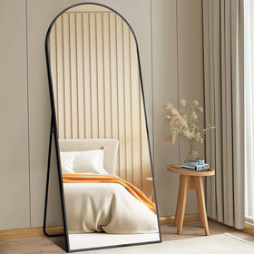 DUMOS arched full-length mirror shows a full-body reflection for outfit checks.