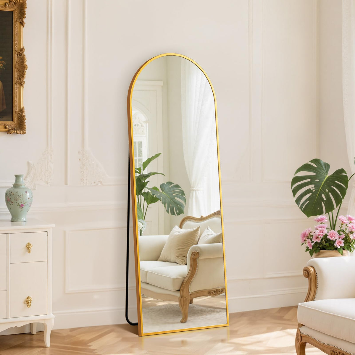 DUMOS arched full-length mirror on gold stand for bedroom dressing and reflections.