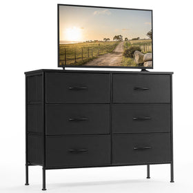 DUMOS dresser with six fabric drawers organizing media and clothing