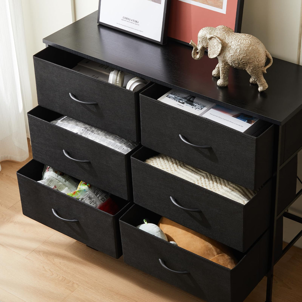 DUMOS dresser functions as a small-space TV stand in tight rooms
