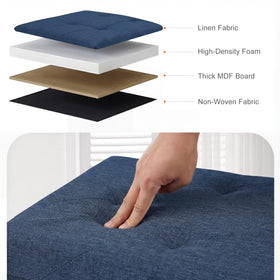 DUMOS blue ottoman used as a foot rest with soft fabric and support.