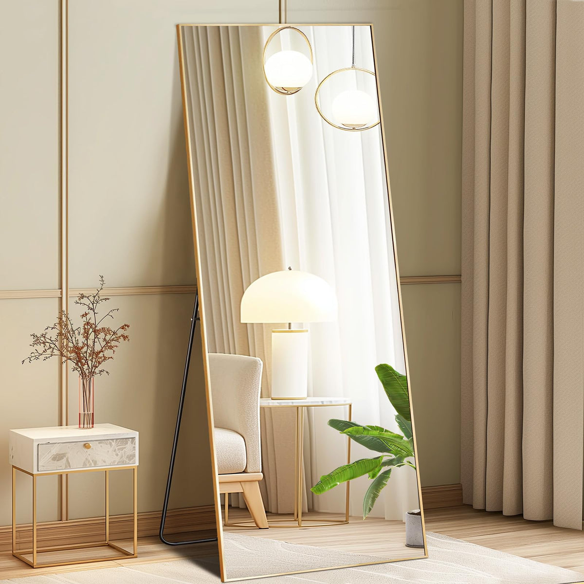 DUMOS full-length mirror with gold frame for elegant bedroom reflections.