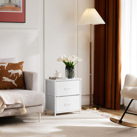 Bedroom setup using DUMOS nightstand as a compact storage solution.
