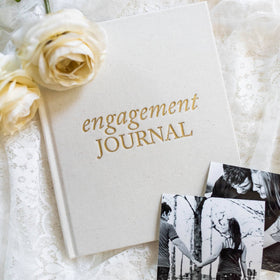 Dedicated photo spaces in Duncan & Stone Engagement Journal for mementos and captions.