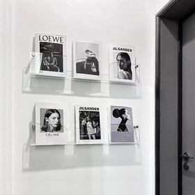 DuvinDD clear acrylic magazine shelf organizes office magazines for a neat workspace.