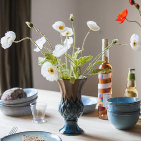 DUYONE white poppy silk bouquet arranged in a slender vase for subtle color