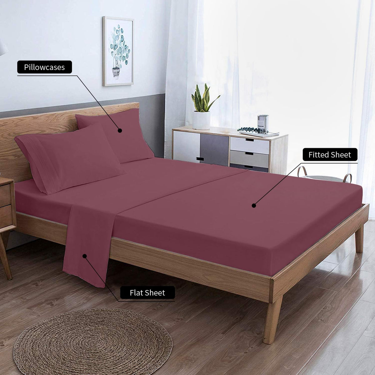 EaseHome Burgundy bed set styled on a bed to show complete four-piece ensemble