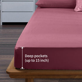 EaseHome Burgundy full-size fitted sheet on mattress highlighting deep-pocket fit up to 18 inches