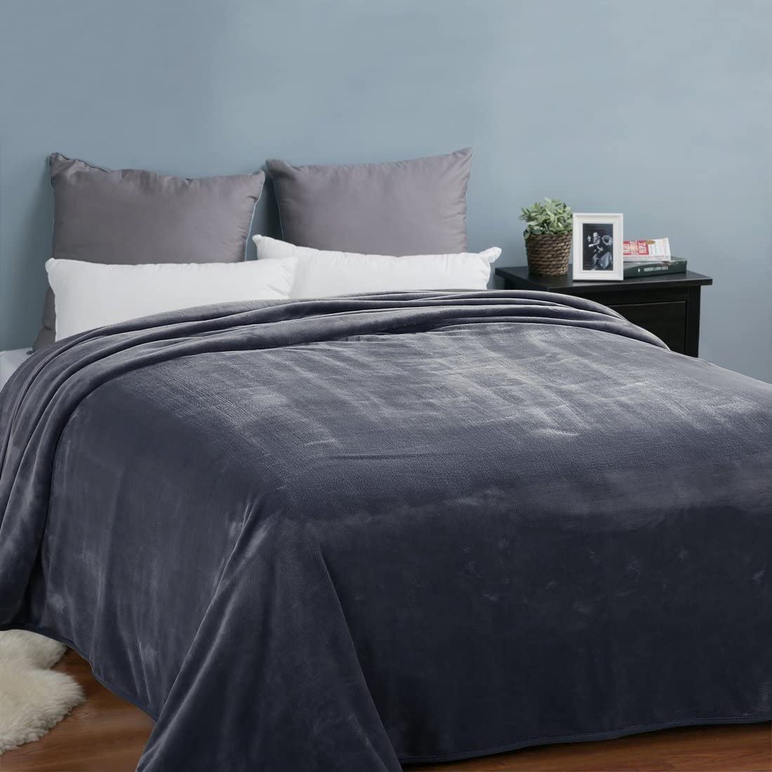 EASELAND versatile blanket on couch and bed for year-round comfort.