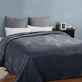 EASELAND versatile blanket on couch and bed for year-round comfort.