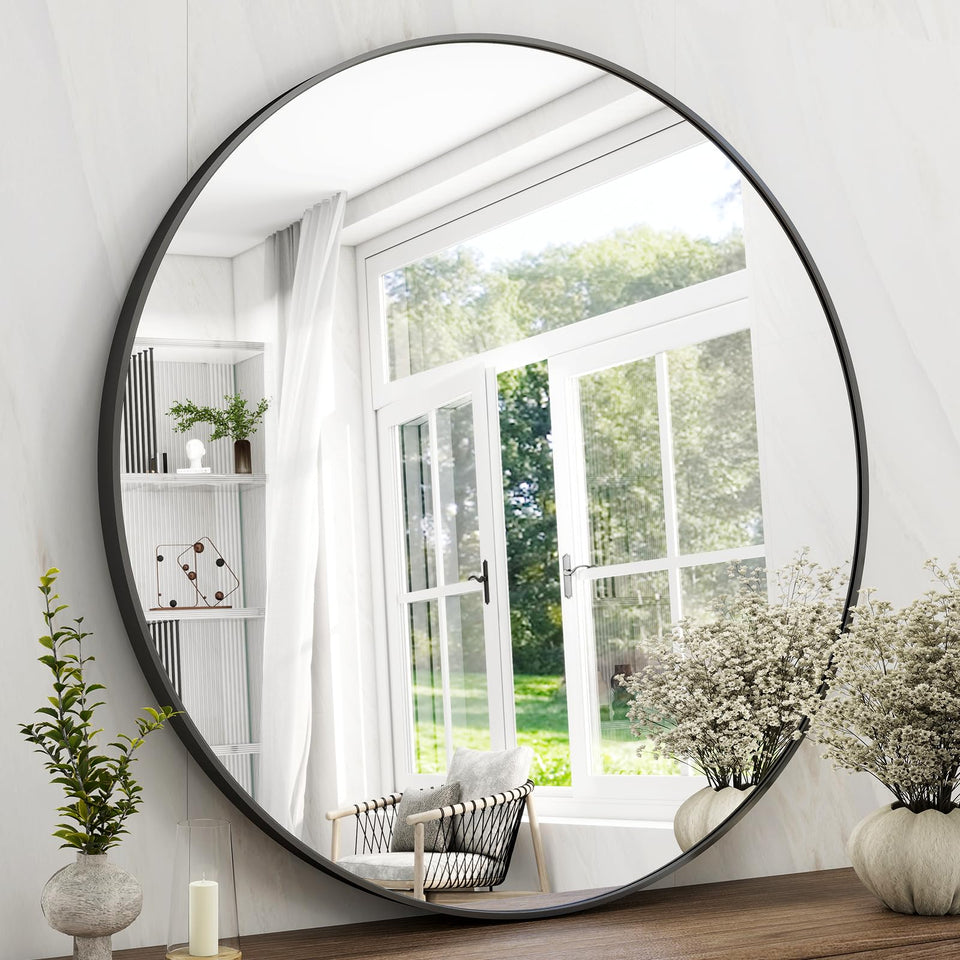 Easly 42-inch round mirror with black frame, wall-mounted for bright reflections.