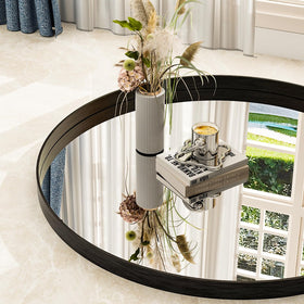 Easly round mirror decorating a hallway with matte black finish for depth.