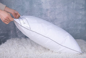 Eastwarmth goose-down cooling pillow care instructions suggest cold washing and air drying.
