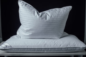 Eastwarmth pillow double stitching and self-piping prevent feather poking.