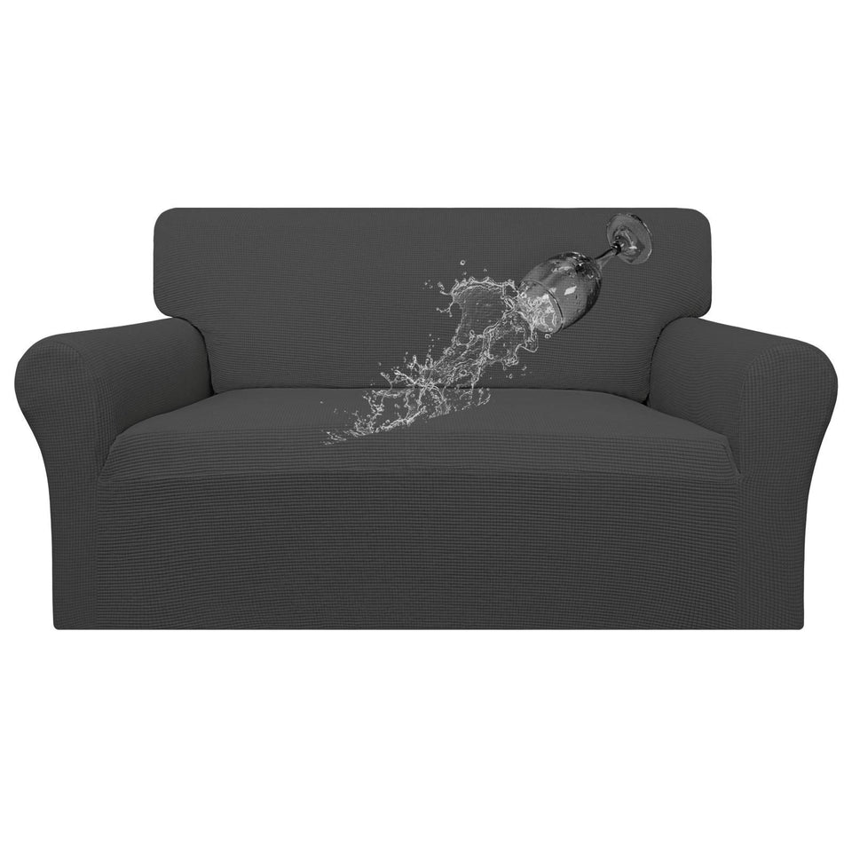 Easy-Going waterproof loveseat cover in dark gray protecting furniture from spills.