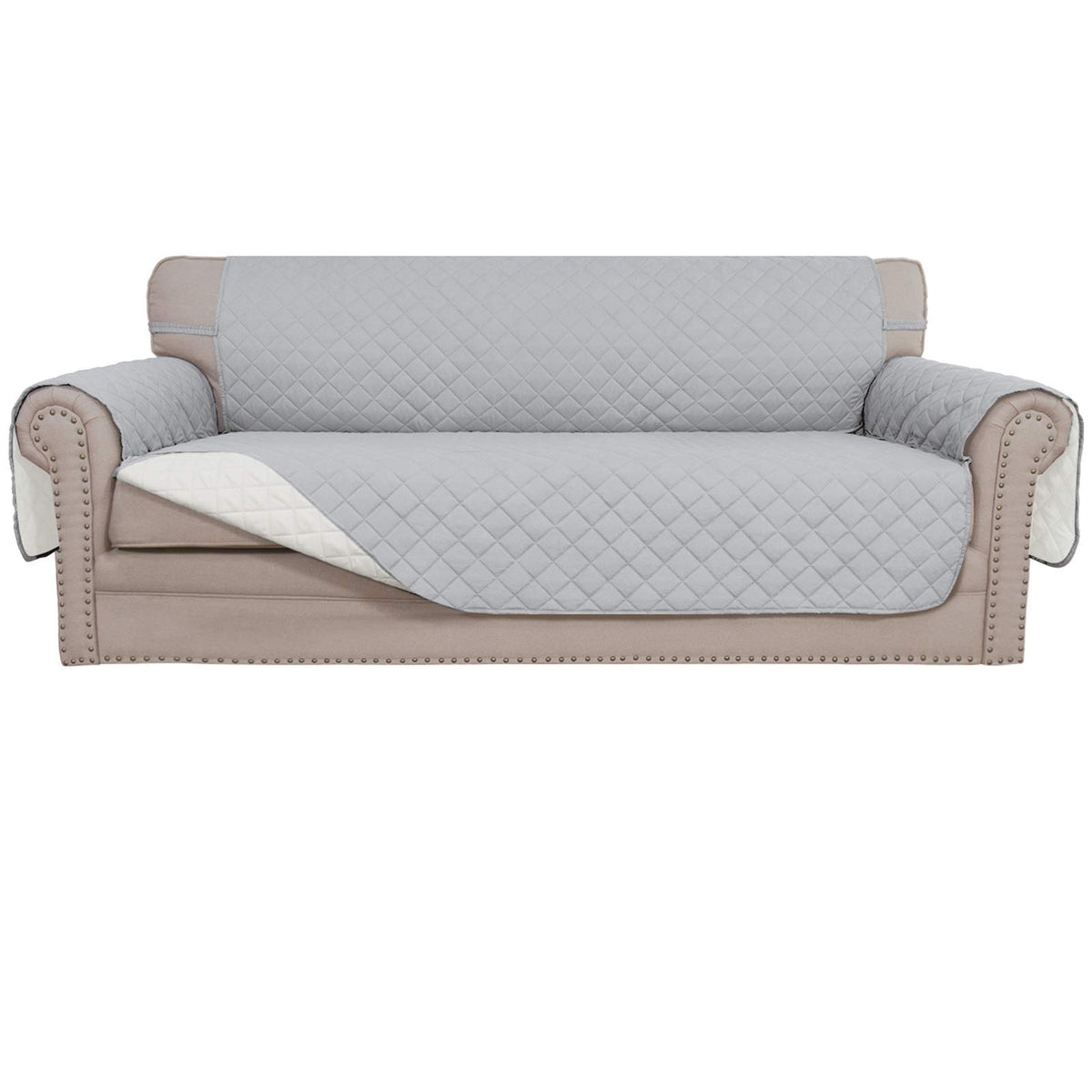Easy-Going reversible couch cover showcases quilted texture for a stylish, protective living room update.