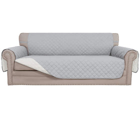 Easy-Going reversible couch cover showcases quilted texture for a stylish, protective living room update.