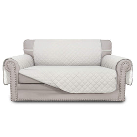 Easy-Going reversible loveseat cover on sofa; protects against daily wear.