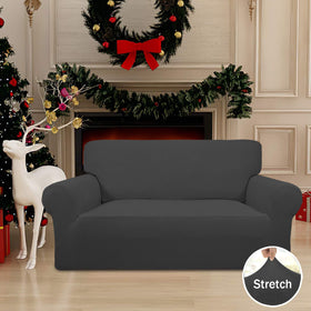 Easy-Going slipcover with elastic bottom anchors showing secure fit for loveseat