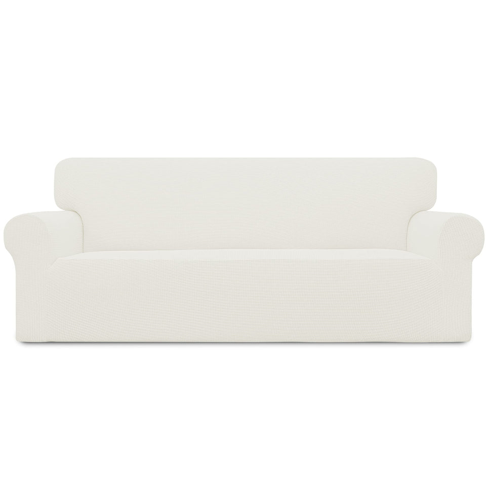 Easy-Going cream stretch slipcover on an oversized sofa enhances protection and comfort.