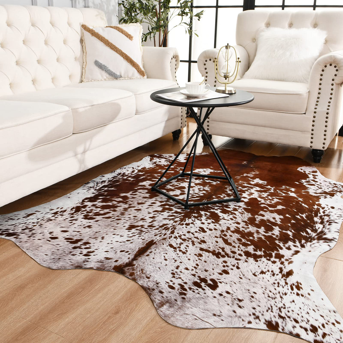 Easycozy cowhide rug close-up pattern adds authentic print and visual interest for living room decor.