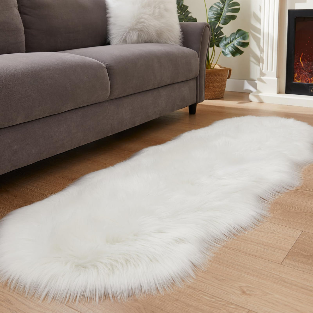 EasyJoy ultra-soft sheepskin rug on white floor for cozy comfort.