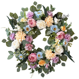 Ecerangus spring wreath on front door boosts curb appeal with lush greenery.
