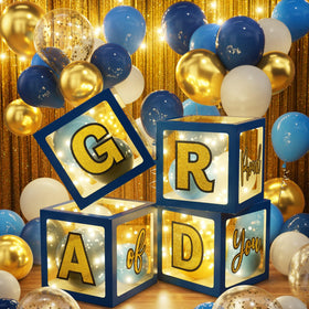 Ecomore 2026 letter cardboard blocks spell GRAD for festive signage.