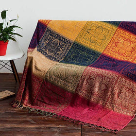 Edcooy Boho Throw Blanket draped on sofa adds soft color and comfort.