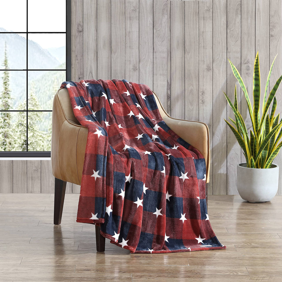 Eddie Bauer Americana plaid red throw on sofa for cozy warmth.