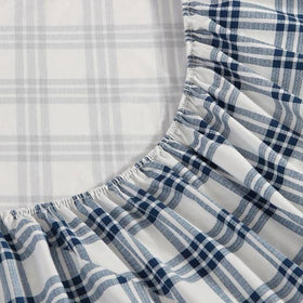 Eddie Bauer percale weave close-up showing crisp texture in navy plaid.