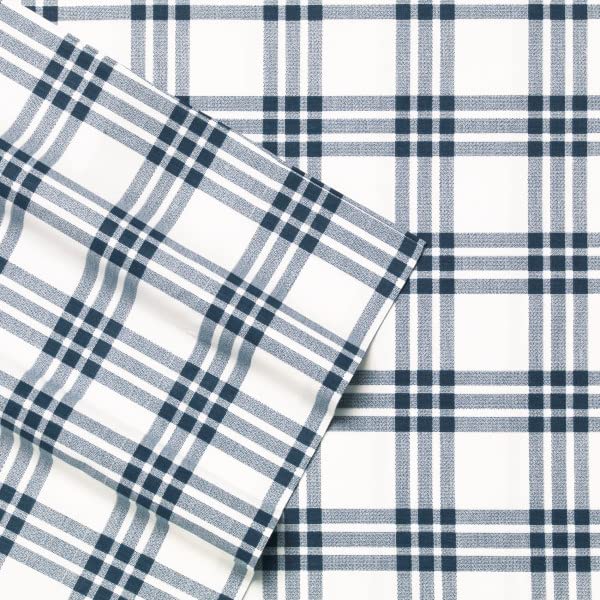 Eddie Bauer Home navy plaid sheet set on twin bed with clean lines.