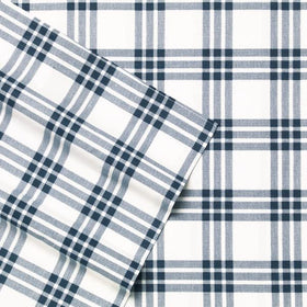 Eddie Bauer Home navy plaid sheet set on twin bed with clean lines.