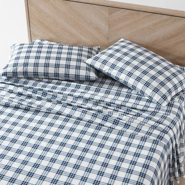 Eddie Bauer Home Percale fitted sheet in navy plaid provides a snug, cool-fit.