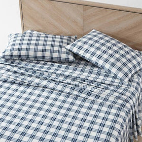 Eddie Bauer Home Percale fitted sheet in navy plaid provides a snug, cool-fit.