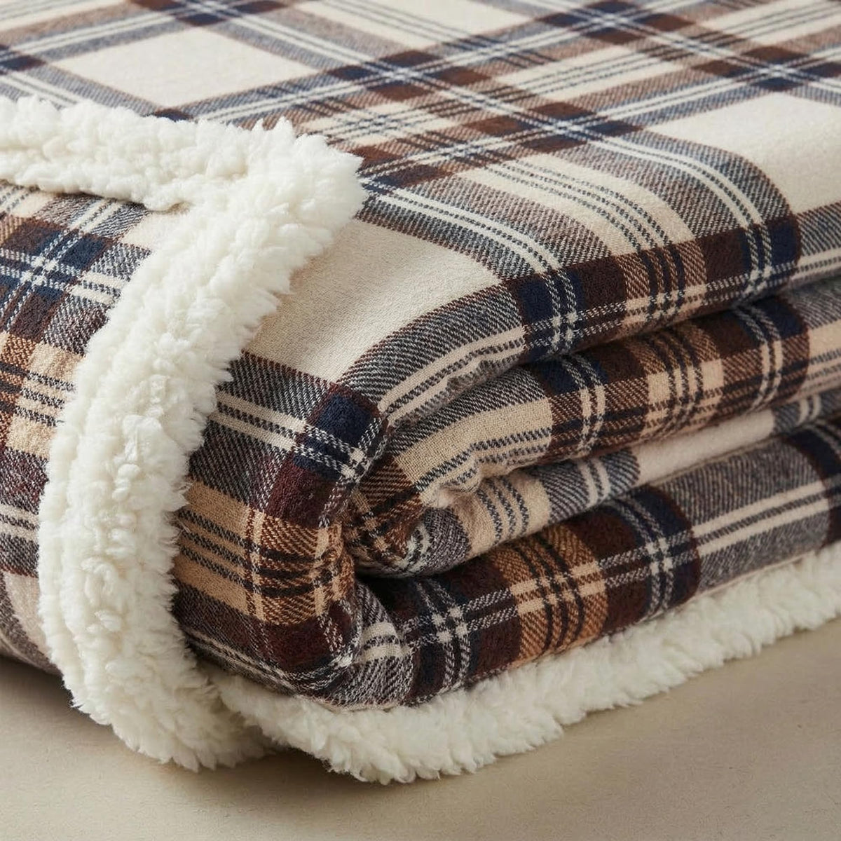 Eddie Bauer reversible sherpa fleece blanket with plush side visible for year-round comfort